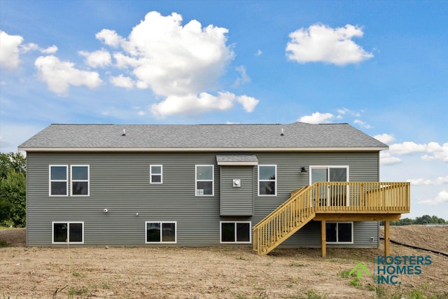 1827 Stratford Ln NW, Grand Rapids, MI 49534 - back of property with a deck, stairway, and roof with shingles