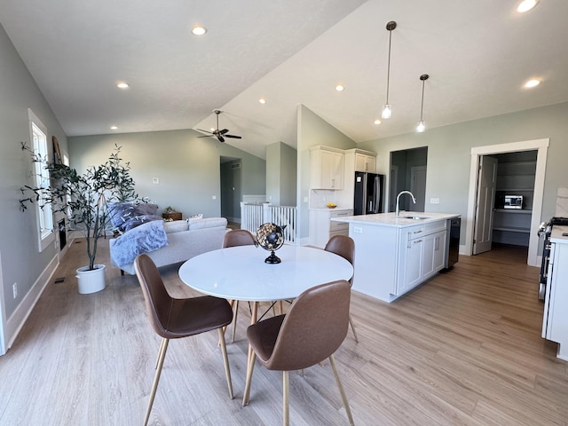 1827 Stratford Ln NW, Grand Rapids, MI 49534 - dining room featuring light wood-type flooring, ceiling fan, vaulted ceiling, and recessed lighting