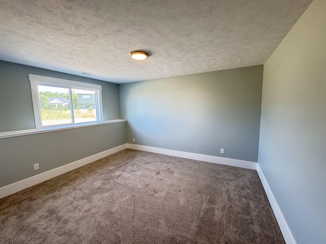 1827 Stratford Ln NW, Grand Rapids, MI 49534 - carpeted empty room featuring a textured ceiling