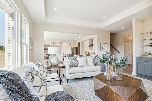 8167 Turning Stone, Kalamazoo, MI 49009 - living room featuring a raised ceiling, recessed lighting, stairway, and light wood finished floors