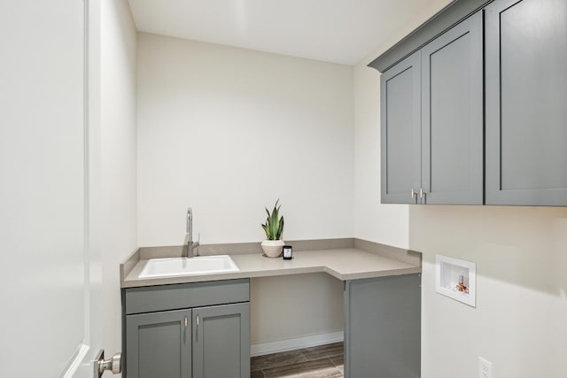 8167 Turning Stone, Kalamazoo, MI 49009 - laundry room featuring hookup for a washing machine, cabinet space, and wood finished floors