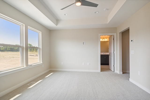 8167 Turning Stone, Kalamazoo, MI 49009 - spare room featuring light carpet, a raised ceiling, ceiling fan, and a smoke detector