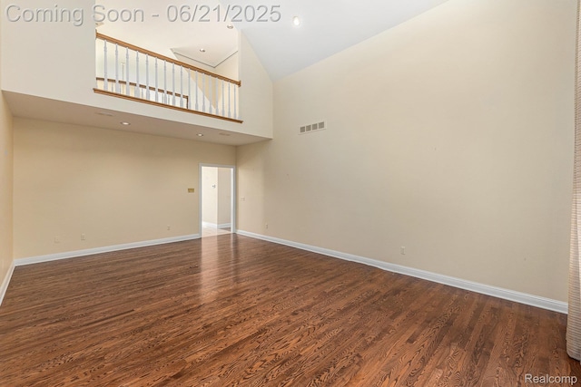 5387 Bristol Parke Dr, Clarkston, MI 48348 - empty room with wood finished floors and a towering ceiling