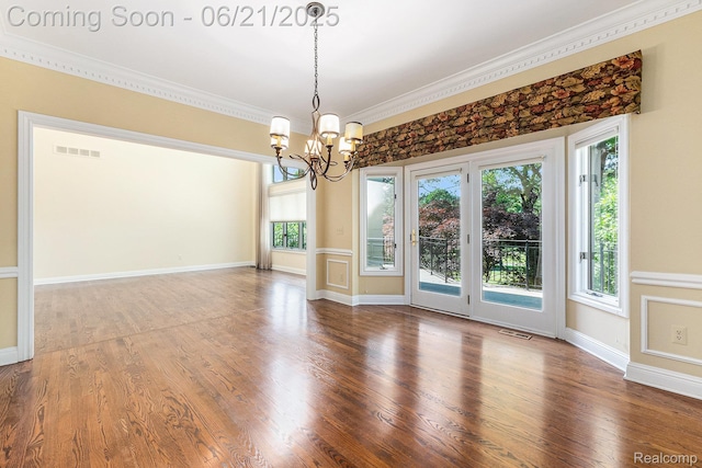5387 Bristol Parke Dr, Clarkston, MI 48348 - spare room featuring a chandelier, ornamental molding, plenty of natural light, and wood finished floors