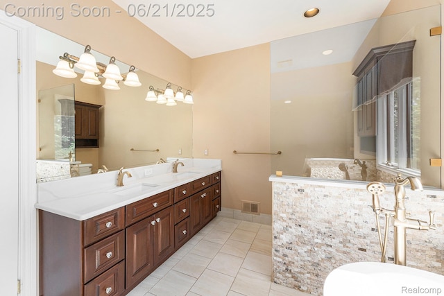 5387 Bristol Parke Dr, Clarkston, MI 48348 - full bath with double vanity, tile patterned floors, and a soaking tub