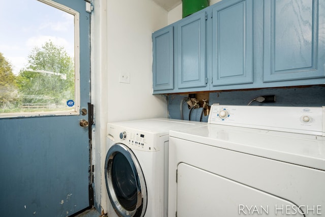 10340 Kartz Rd, Greenville, MI 48838 - laundry area featuring cabinet space, washer and dryer, and healthy amount of natural light