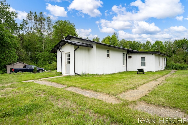 10340 Kartz Rd, Greenville, MI 48838 - back of house with a yard