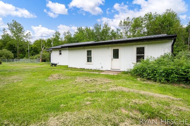 10340 Kartz Rd, Greenville, MI 48838 - back of house featuring a metal roof
