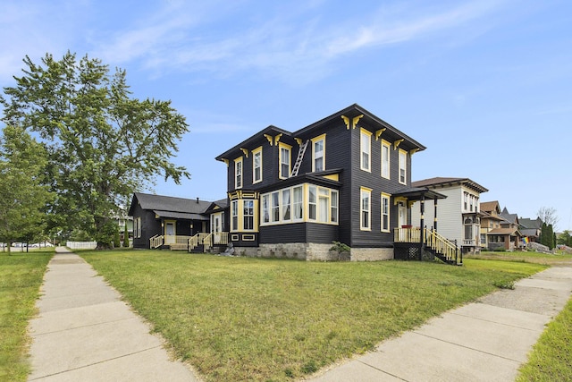 390 W Muskegon Ave, Muskegon, MI 49440 - view of home's exterior with a yard