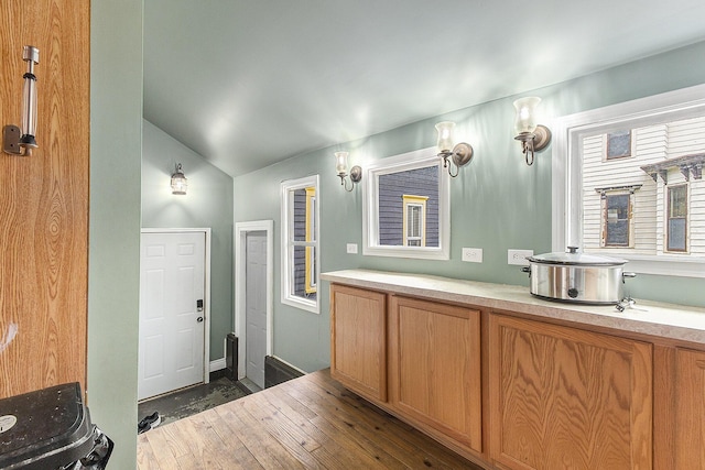 390 W Muskegon Ave, Muskegon, MI 49440 - bathroom featuring vaulted ceiling and vanity