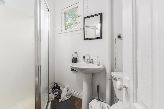 390 W Muskegon Ave, Muskegon, MI 49440 - bathroom featuring a stall shower and wood finished floors