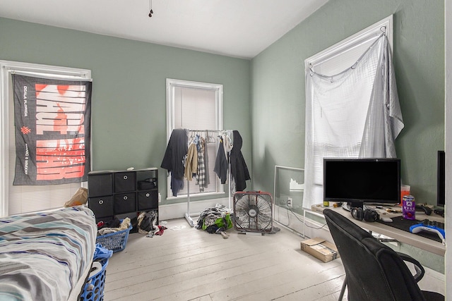 390 W Muskegon Ave, Muskegon, MI 49440 - bedroom featuring an office area and wood-type flooring