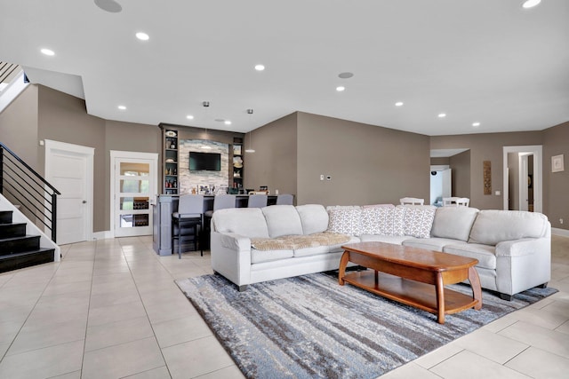 7074 S Ainger Rd, Olivet, MI 49076 - living area with stairs, light tile patterned floors, and recessed lighting