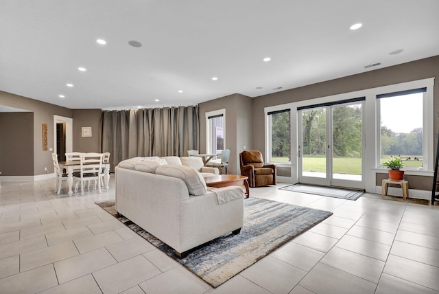 7074 S Ainger Rd, Olivet, MI 49076 - living room featuring recessed lighting and light tile patterned floors