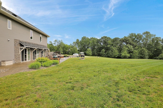 7074 S Ainger Rd, Olivet, MI 49076 - view of grassy yard featuring a patio area