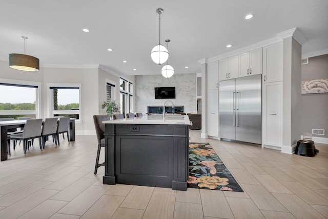 7074 S Ainger Rd, Olivet, MI 49076 - kitchen featuring built in fridge, crown molding, light countertops, recessed lighting, and white cabinetry