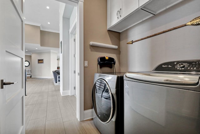 7074 S Ainger Rd, Olivet, MI 49076 - laundry room featuring cabinet space, crown molding, washing machine and clothes dryer, and recessed lighting