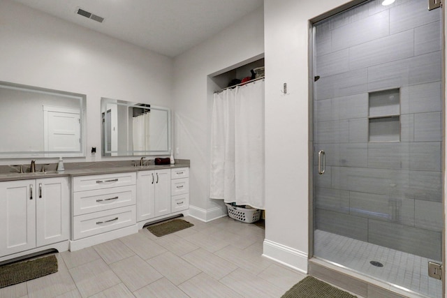 7074 S Ainger Rd, Olivet, MI 49076 - bathroom featuring a stall shower and double vanity