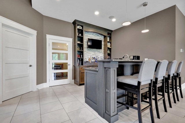 7074 S Ainger Rd, Olivet, MI 49076 - bar with pendant lighting, light tile patterned flooring, and recessed lighting