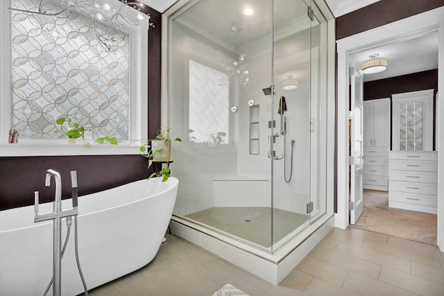 7074 S Ainger Rd, Olivet, MI 49076 - bathroom with a shower stall, a soaking tub, and tile patterned flooring