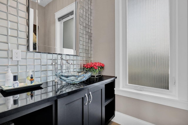 7074 S Ainger Rd, Olivet, MI 49076 - bathroom featuring backsplash and vanity
