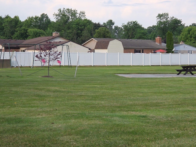 20041 Village Green Ct Unit 14, Brownstown, MI 48183 - view of yard with view of wooded area