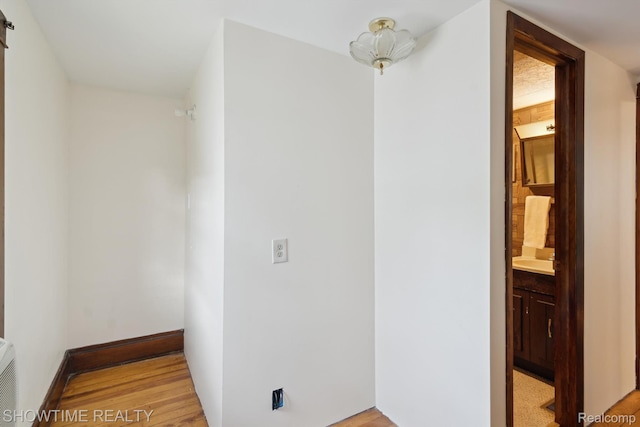 34 Charles St, Hillsdale, MI 49242 - corridor with light wood finished floors and baseboards