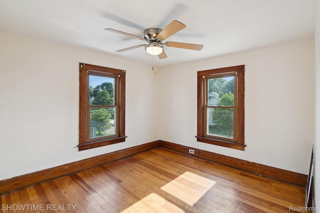 34 Charles St, Hillsdale, MI 49242 - unfurnished room with plenty of natural light, hardwood / wood-style flooring, and ceiling fan
