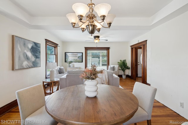 34 Charles St, Hillsdale, MI 49242 - dining area with a chandelier, wood finished floors, and ceiling fan