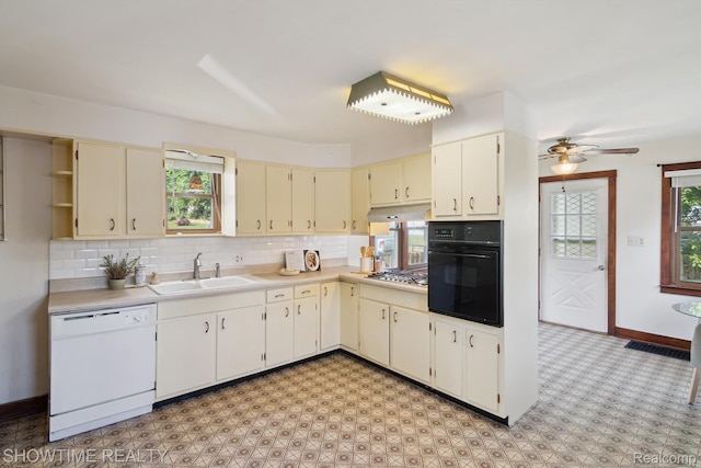 34 Charles St, Hillsdale, MI 49242 - kitchen featuring dishwasher, oven, cream cabinets, and stainless steel gas cooktop