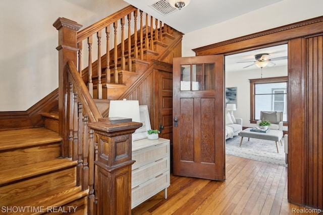 34 Charles St, Hillsdale, MI 49242 - staircase featuring hardwood / wood-style floors and a ceiling fan