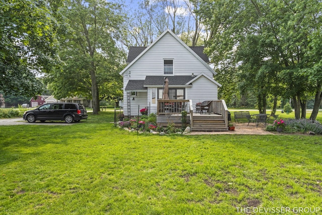 3665 47th St, Hamilton, MI 49419 - rear view of property featuring a deck, roof with shingles, and a yard