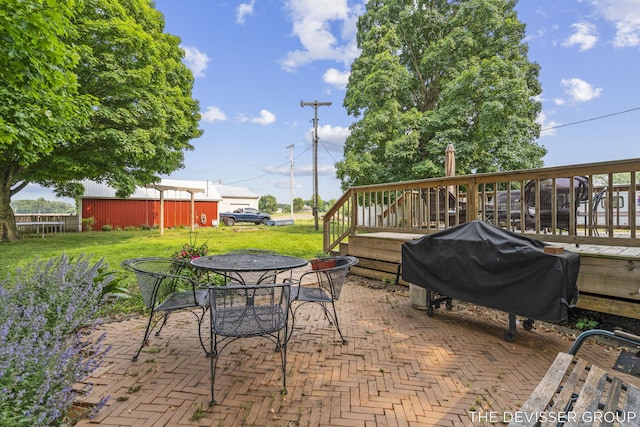 3665 47th St, Hamilton, MI 49419 - view of patio featuring a grill, a deck, and outdoor dining space