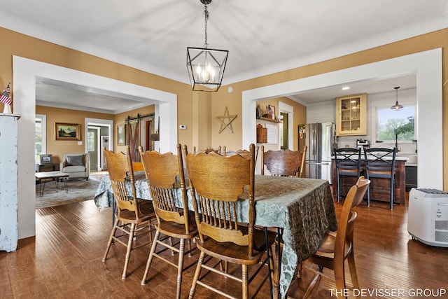 3665 47th St, Hamilton, MI 49419 - dining space with plenty of natural light, dark wood-type flooring, and a chandelier