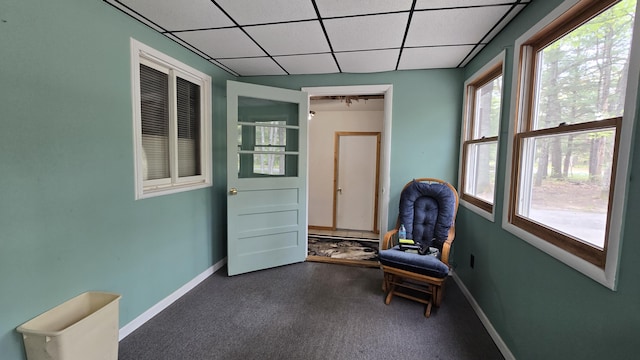 211 Skocelas Rd N, Manistee, MI 49660 - living area featuring a paneled ceiling and carpet floors