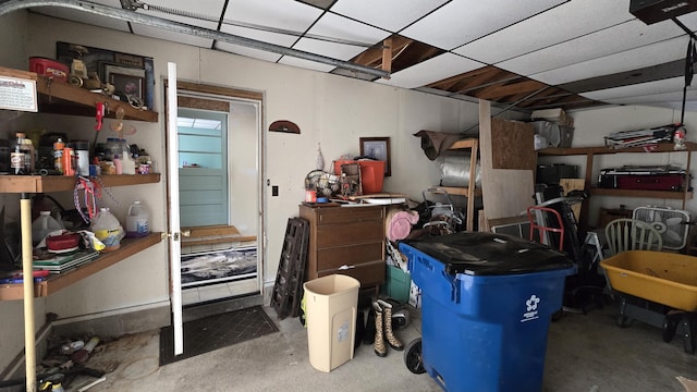 211 Skocelas Rd N, Manistee, MI 49660 - garage featuring a garage door opener