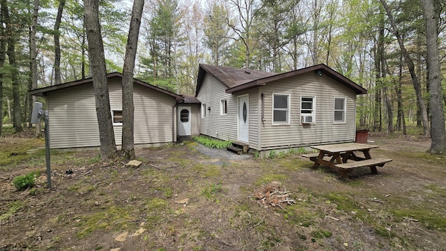 211 Skocelas Rd N, Manistee, MI 49660 - rear view of house featuring entry steps and cooling unit