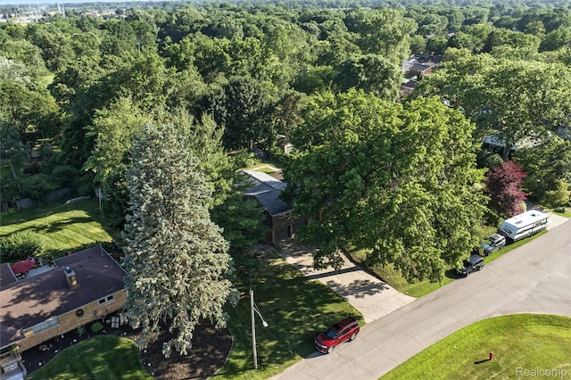 2329 Cumberland Rd, Lansing, MI 48906 - aerial view of property and surrounding area with a heavily wooded area