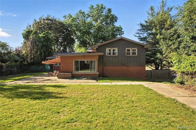 2329 Cumberland Rd, Lansing, MI 48906 - back of property featuring brick siding