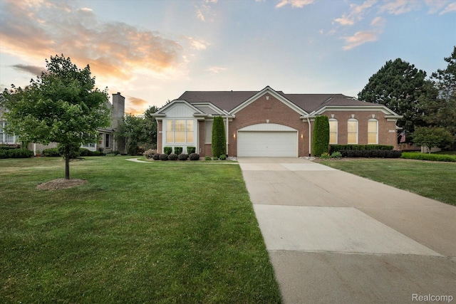 1921 Dunham Dr, Rochester, MI 48306 - view of front of house with brick siding, a front yard, driveway, and a garage