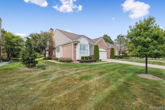 1921 Dunham Dr, Rochester, MI 48306 - view of front facade with brick siding, a chimney, driveway, a front yard, and an attached garage