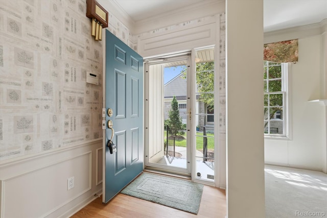 1921 Dunham Dr, Rochester, MI 48306 - foyer entrance featuring crown molding, a decorative wall, and light wood finished floors