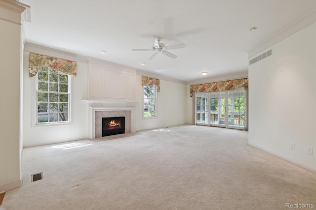 1921 Dunham Dr, Rochester, MI 48306 - unfurnished living room featuring a ceiling fan, a tiled fireplace, plenty of natural light, and crown molding