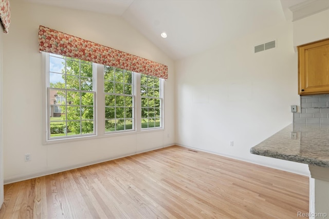 1921 Dunham Dr, Rochester, MI 48306 - unfurnished dining area with light wood finished floors, lofted ceiling, and recessed lighting
