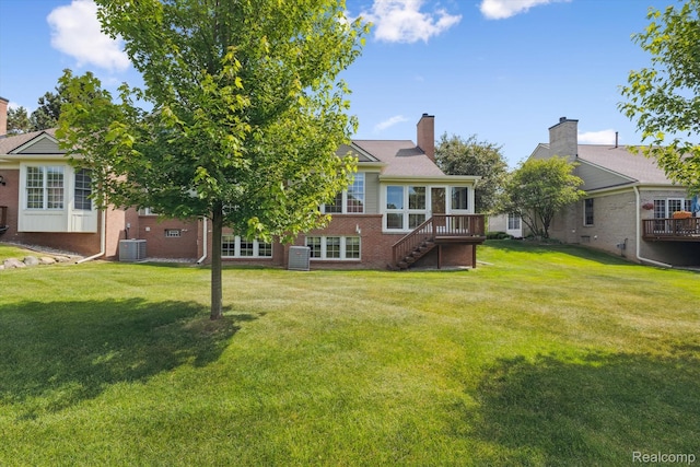 1921 Dunham Dr, Rochester, MI 48306 - back of house with brick siding, stairs, a yard, a chimney, and a deck