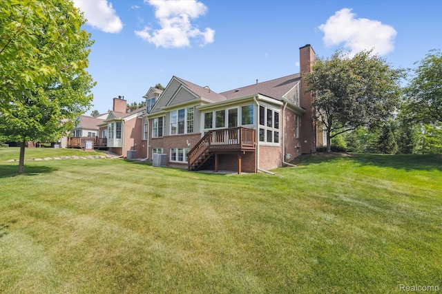 1921 Dunham Dr, Rochester, MI 48306 - rear view of property featuring a chimney, stairs, brick siding, and a deck