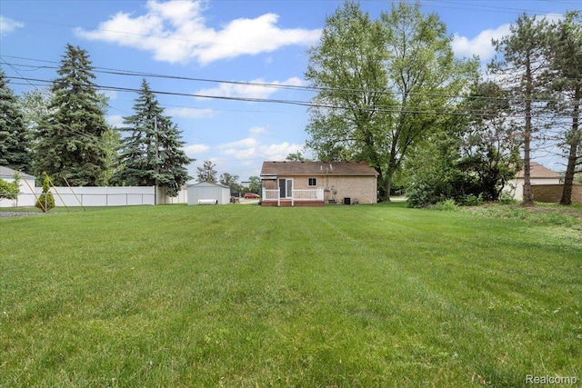 12115 Newburgh Rd, Livonia, MI 48150 - view of yard featuring a storage unit