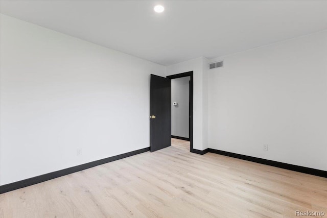 12115 Newburgh Rd, Livonia, MI 48150 - empty room featuring light wood-style flooring and baseboards
