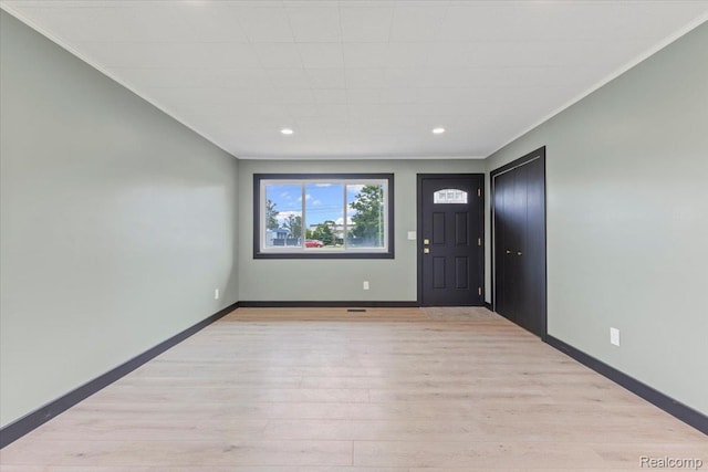12115 Newburgh Rd, Livonia, MI 48150 - foyer entrance featuring recessed lighting, light wood-style flooring, and ornamental molding