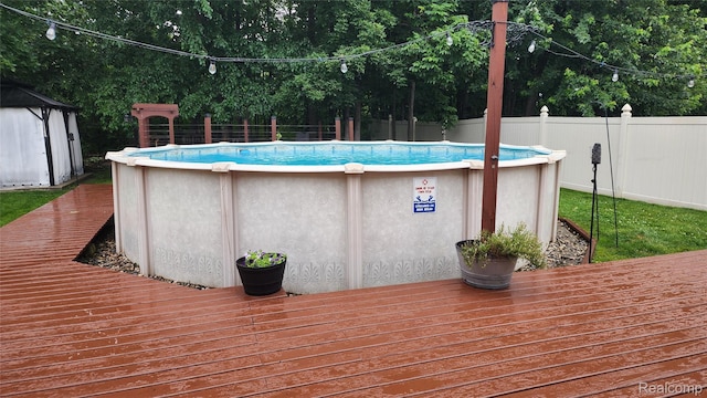29390 Juniper St, Trenton, MI 48183 - wooden deck featuring a storage unit